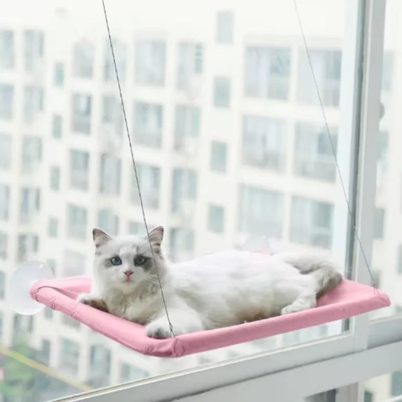 Hamac de fenêtre rose pastel pour chat sur vitre d'appartement