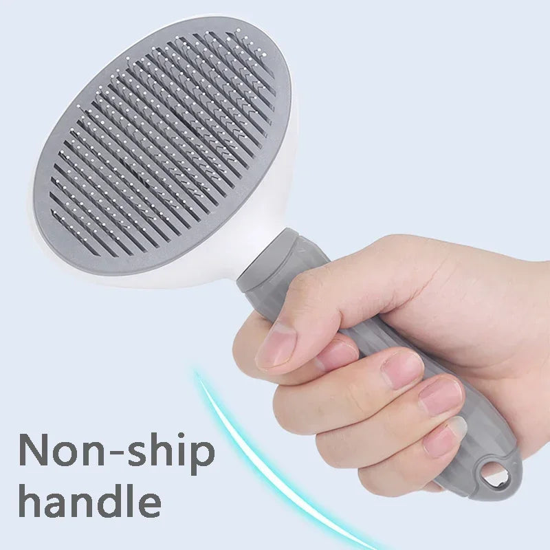 Brosse démêlante pour chat et petit chien avec nettoyage en un clic.