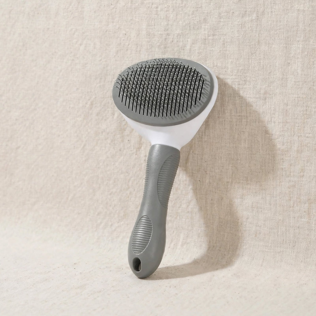 Brosse autonettoyante pour chats et chiens grise