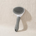 Brosse autonettoyante pour chats et chiens grise
